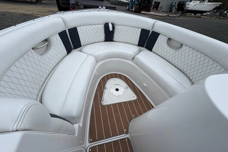 Slide: The Image of Luxurious interior of 2002 Chris-Craft Launch 28 boat with white cushioned seating. - 14