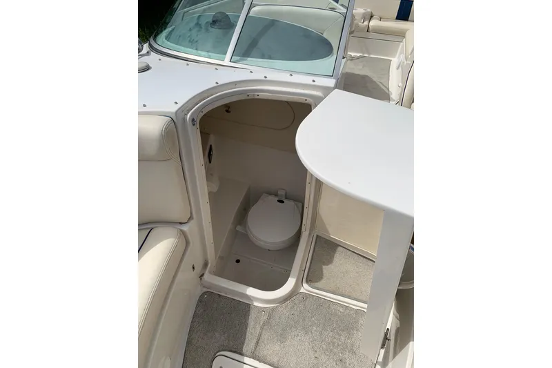 Slide: The Image of 2002 Chris Craft 28 Launch boat interior with compact toilet compartment. - 4