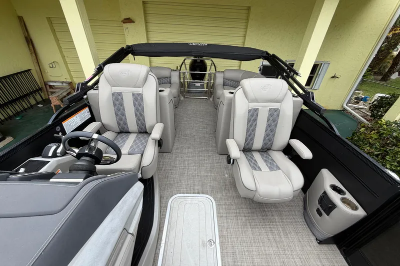 Slide: The Image of 2022 Barletta Lusso 23QCSS pontoon boat interior with luxurious seating and modern design. - 12