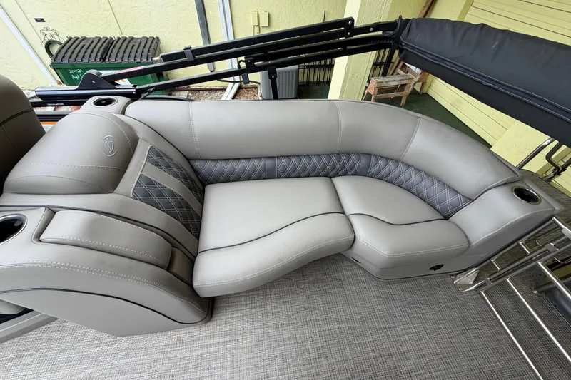 Slide: The Image of Luxurious seating on 2022 Barletta Lusso 23QCSS pontoon boat, featuring elegant gray upholstery. - 14