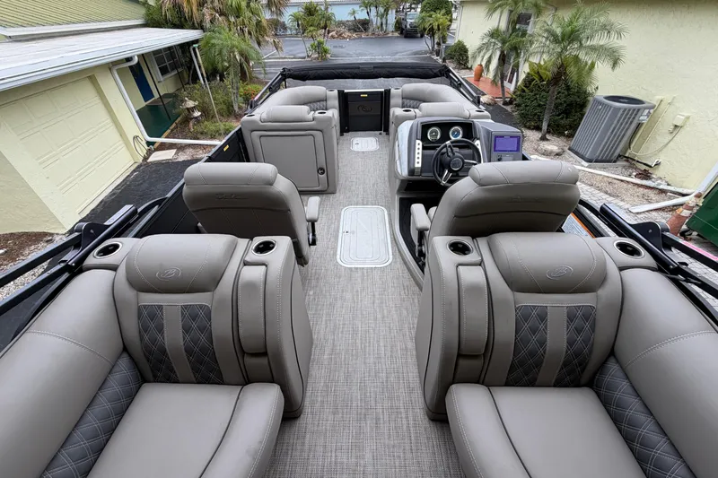 Slide: The Image of Luxurious interior of 2022 Barletta Lusso 23QCSS pontoon boat with plush seating and modern dashboard. - 15