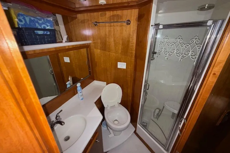 Slide: The Image of Bathroom in 2006 Navigator 53 Extended Deckhouse with shower, toilet, and sink. - 14