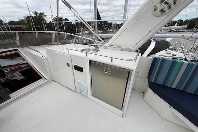 Slide: The Image of 2006 Navigator 53 Extended Deckhouse yacht with outdoor sink and seating area. - 3