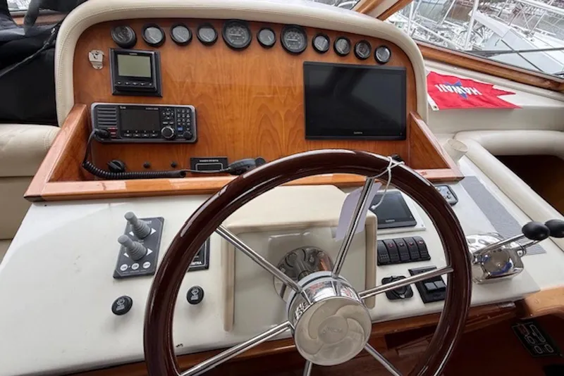 Slide: The Image of Helm of 2006 Navigator 53 Extended Deckhouse with navigation instruments and steering wheel. - 5