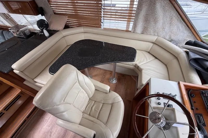 Slide: The Image of Luxurious 2006 Navigator 53 yacht interior with leather seating and sleek black table. - 6