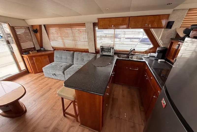 Slide: The Image of Interior of 2006 Navigator 53 Extended Deckhouse yacht with kitchen and seating area. - 7