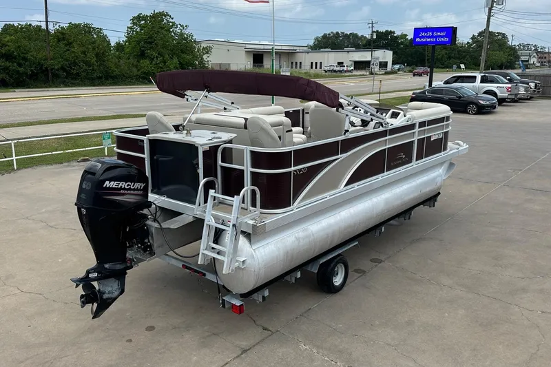 Slide: The Image of 2018 Bennington 20 SX Fish pontoon boat with Mercury outboard motor on trailer. - 4