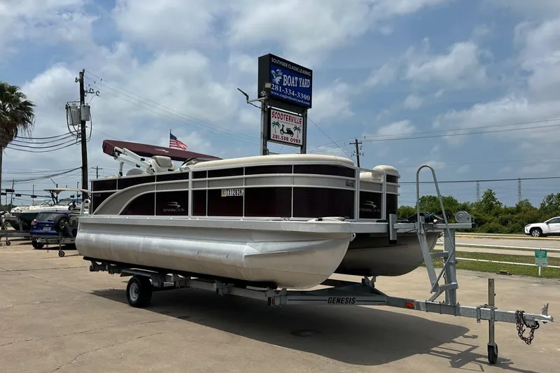 Slide: The Image of 2018 Bennington 20 SX Fish pontoon boat on trailer at dealership. - 6