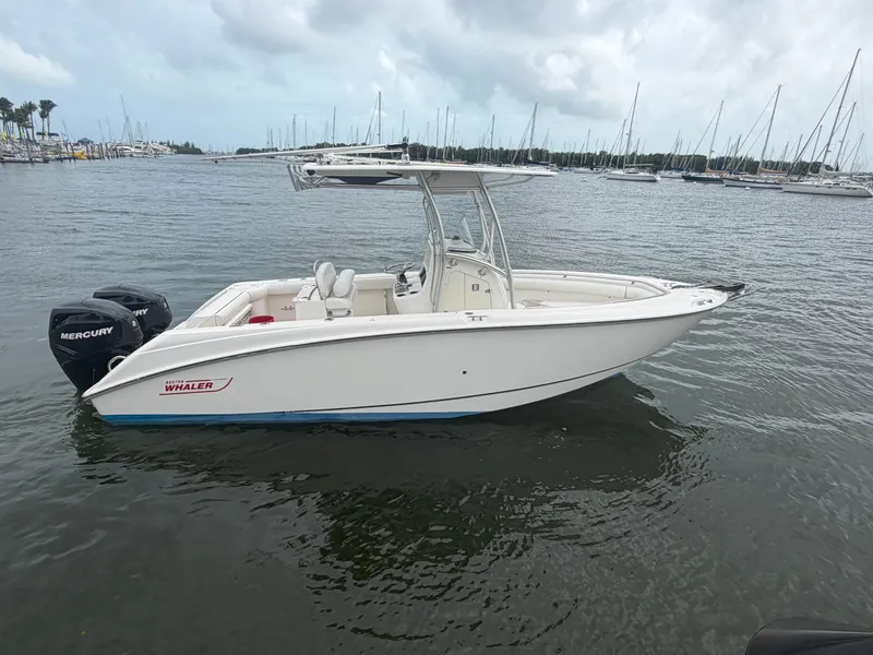 Slide: The Image of 2006 Boston Whaler 240 Outrage boat on calm water. - 6
