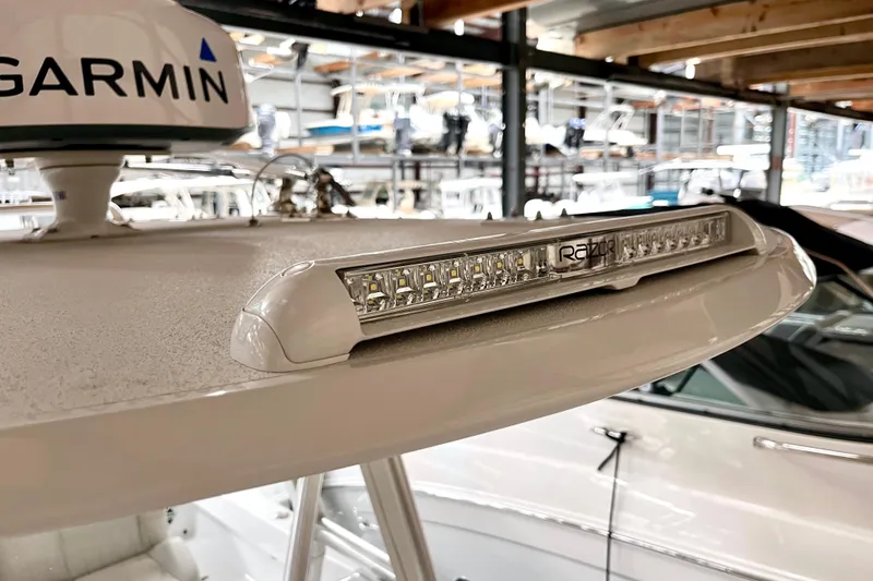 Slide: The Image of 2023 Conch 30 boat with Garmin radar and Razor LED light bar in a marina. - 10