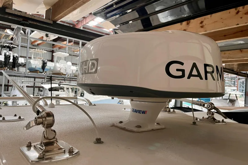 Slide: The Image of Garmin radar on 2023 Conch 30 boat, stored in a marina with other vessels. - 11