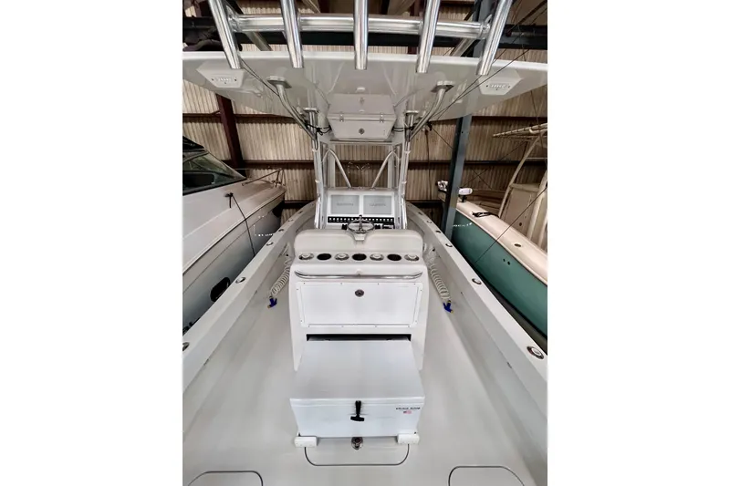 Slide: The Image of 2023 Conch 30 boat interior with helm station and storage compartments. - 15