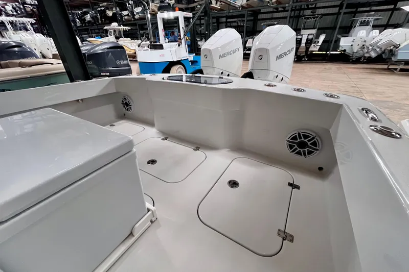 Slide: The Image of Interior view of 2023 Conch 30 boat with Mercury engines in a showroom. - 18