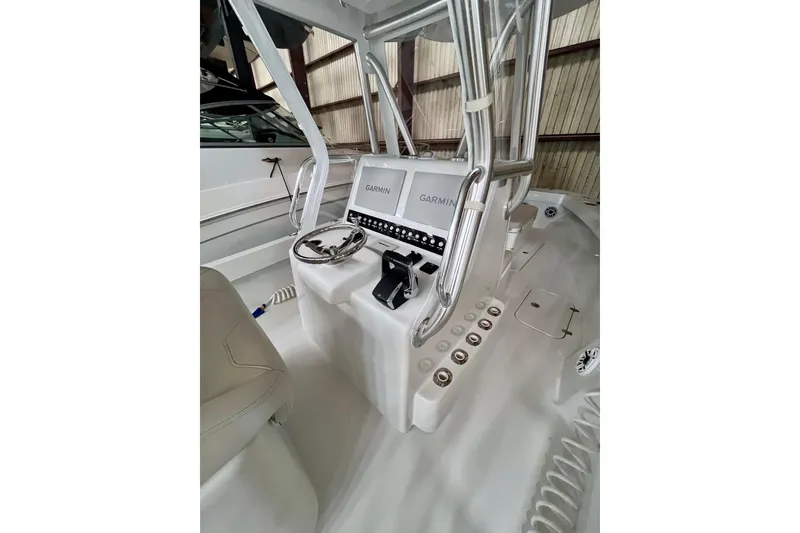 Slide: The Image of 2023 Conch 30 boat console with Garmin navigation system and steering wheel. - 3