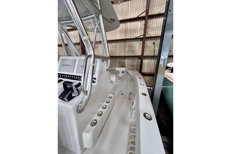 Slide: The Image of 2023 Conch 30 boat interior with Garmin navigation system in a storage facility. - 5