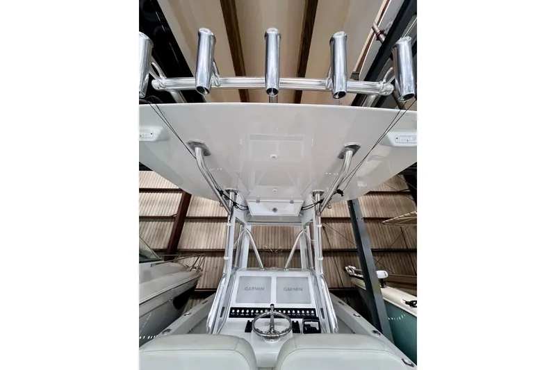 Slide: The Image of 2023 Conch 30 boat interior with rod holders and Garmin electronics. - 8
