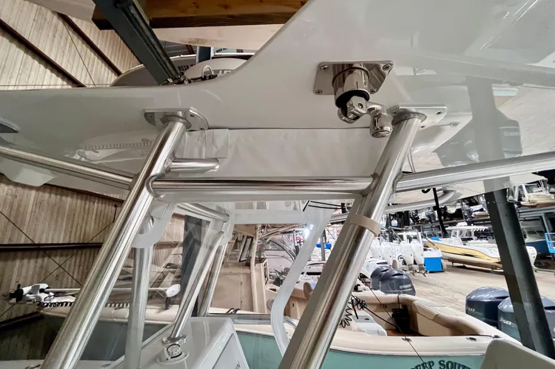 Slide: The Image of 2023 Conch 30 boat interior with stainless steel supports in a storage facility. - 9