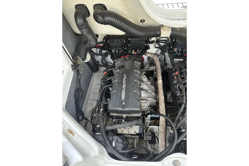 Slide: The Image of Engine compartment of a 2016 Yamaha Boats 212SS, showcasing the high-output engine. - 10