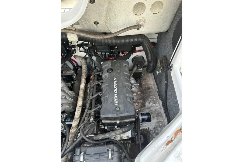 Slide: The Image of Engine compartment of a 2016 Yamaha Boats 212SS, featuring a high output engine. - 13