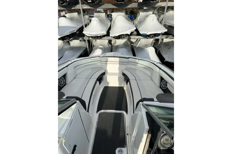 Slide: The Image of 2016 Yamaha Boats 212SS interior with white seating and sleek design. - 18