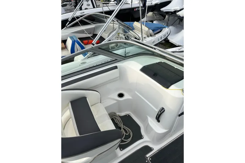 Slide: The Image of 2016 Yamaha Boats 212SS interior with seating and storage compartments. - 27
