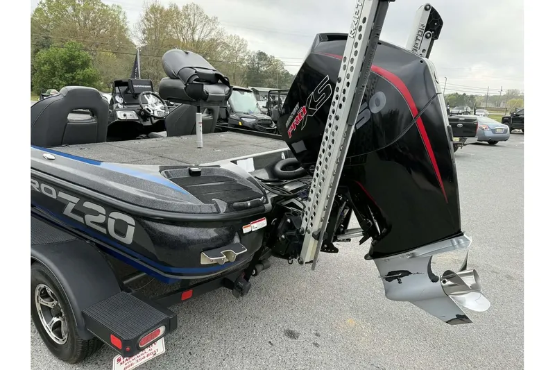 Slide: The Image of Nitro Z20 Pro 2022 boat with powerful outboard motor, parked on a trailer. - 3