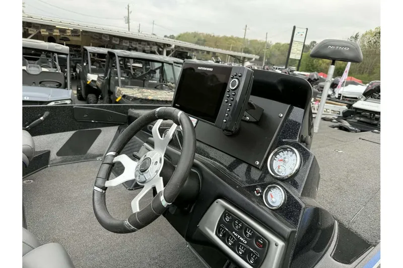 Slide: The Image of Nitro Z20 Pro 2022 boat dashboard with steering wheel and electronic display. - 5