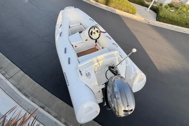 Slide: The Image of 2019 Brig Eagle 340 inflatable boat with Yamaha outboard motor on pavement. - 14