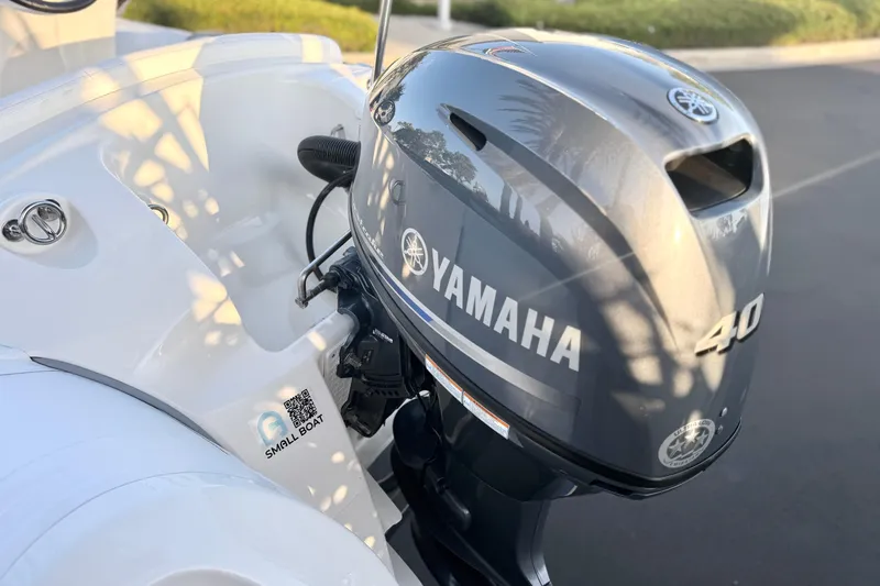 Slide: The Image of 2019 Brig Eagle 340 with Yamaha 40HP outboard motor, parked on pavement. - 16