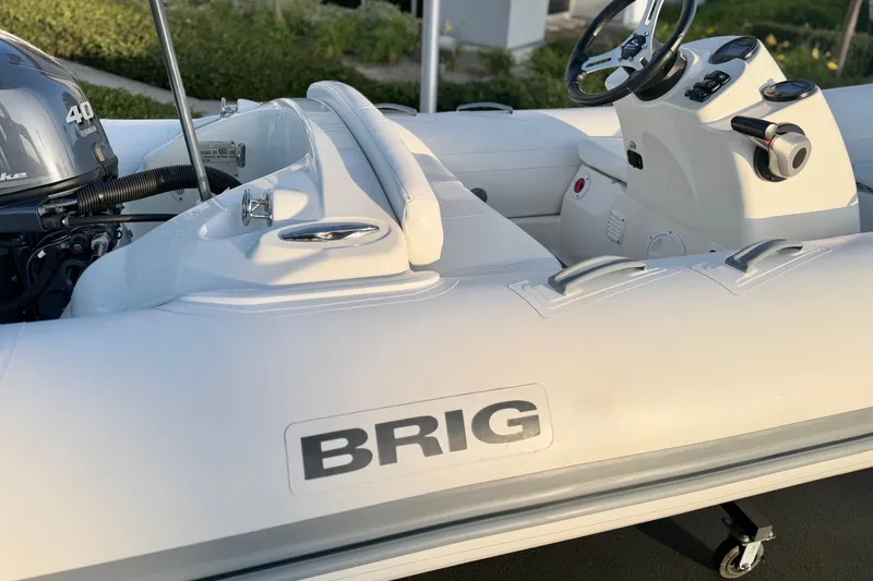 Slide: The Image of 2019 Brig Eagle 340 inflatable boat with steering console and outboard motor. - 18