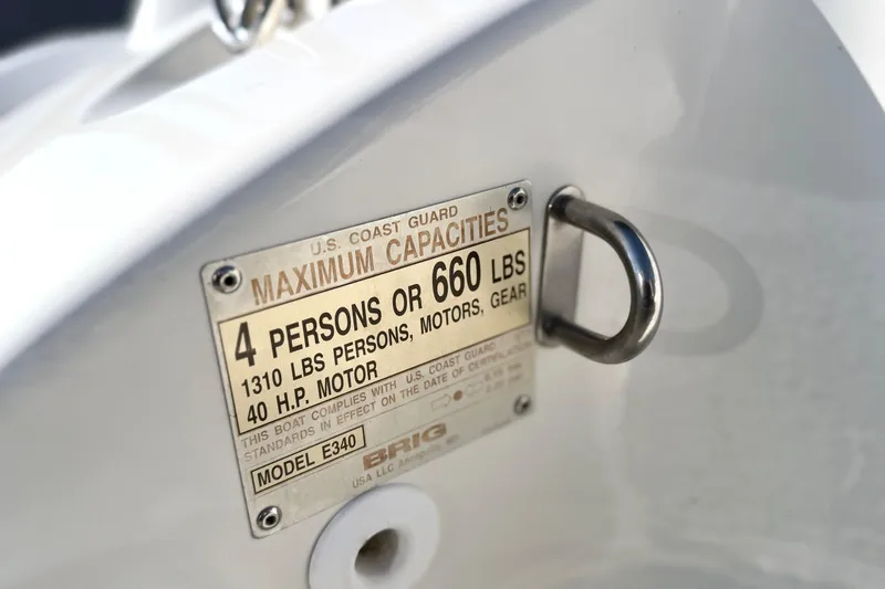 Slide: The Image of 2019 Brig Eagle 340 capacity plate showing maximum load and motor specifications. - 7