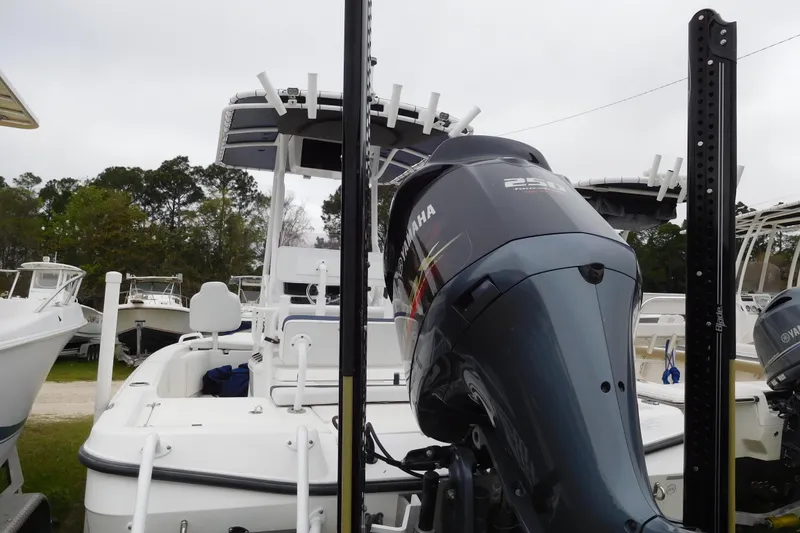 Slide: The Image of 2007 Century 2202 Inshore boat with Yamaha outboard motor, docked outdoors. - 3