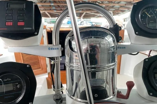 Slide: The Image of Cockpit of 1984 Endeavour 35 sailboat with navigation instruments and steering wheel. - 12