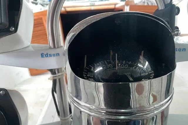Slide: The Image of Compass on 1984 Endeavour 35 sailboat, featuring Edson steering system. - 14