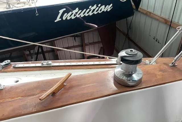 Slide: The Image of 1984 Endeavour 35 sailboat deck with winch and cleat, featuring "Intuition" name. - 17