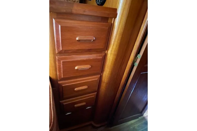 Slide: The Image of Wooden drawers inside a 1984 Endeavour 35 boat, showcasing classic nautical craftsmanship. - 20