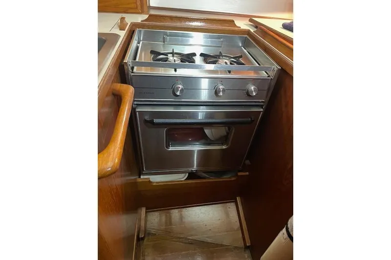 Slide: The Image of Stainless steel stove and oven in 1984 Endeavour 35 yacht kitchen. - 36
