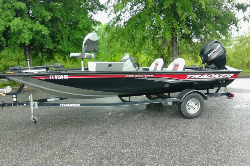 The Image of 2016 Tracker Pro Team 175 TXW fishing boat on trailer, parked outdoors. - 1