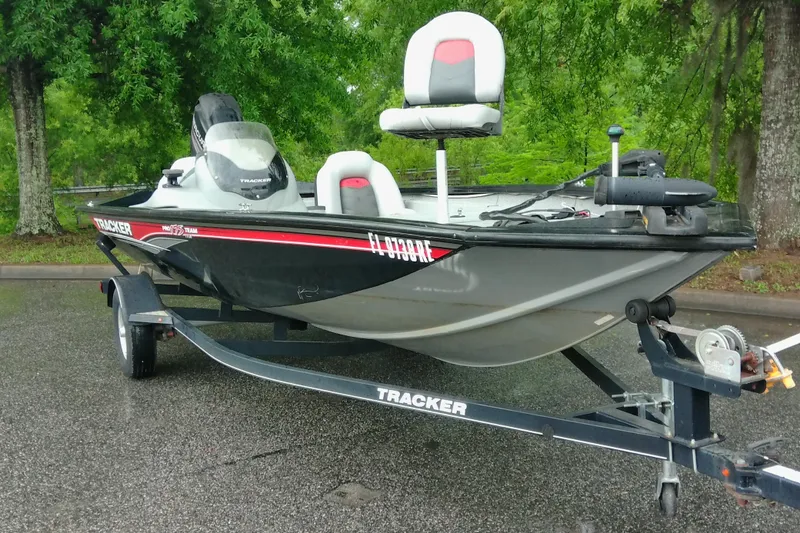 Slide: The Image of 2016 Tracker Pro Team 175 TXW fishing boat on trailer, parked outdoors. - 4