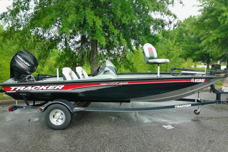 Slide: The Image of 2016 Tracker Pro Team 175 TXW fishing boat on trailer, parked outdoors. - 5
