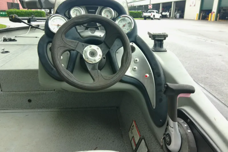 Slide: The Image of Steering console of 2016 Tracker Pro Team 175 TXW boat with gauges and controls. - 7