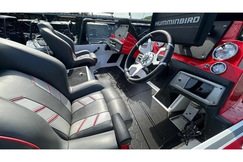 Slide: The Image of 2023 Nitro Z20 Pro boat interior with steering wheel and seats, featuring Humminbird electronics. - 7
