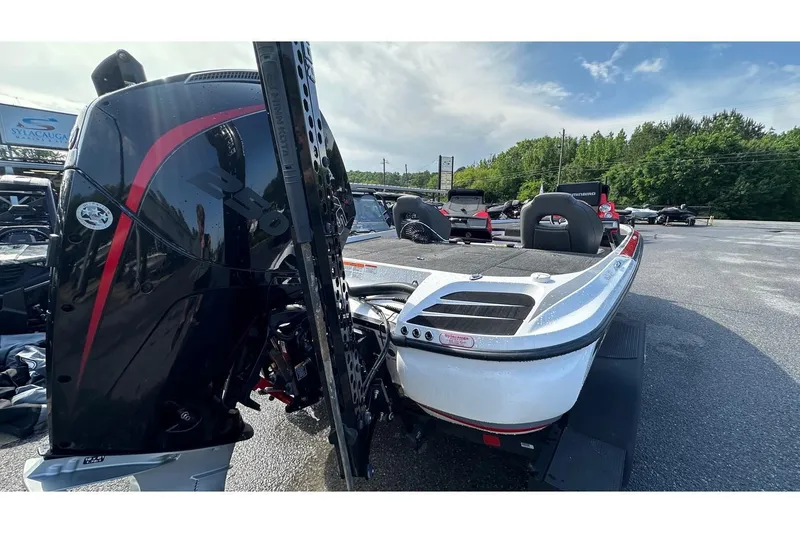 Slide: The Image of 2023 Nitro Z20 Pro boat with powerful outboard motor in a parking lot. - 70