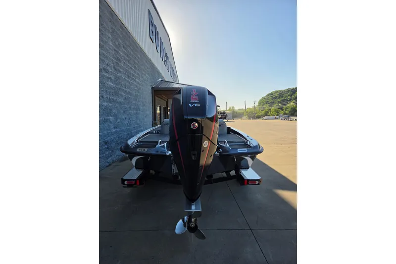 Slide: The Image of 2026 Phoenix 818 Pro boat with powerful V6 engine, parked outside a building. - 5