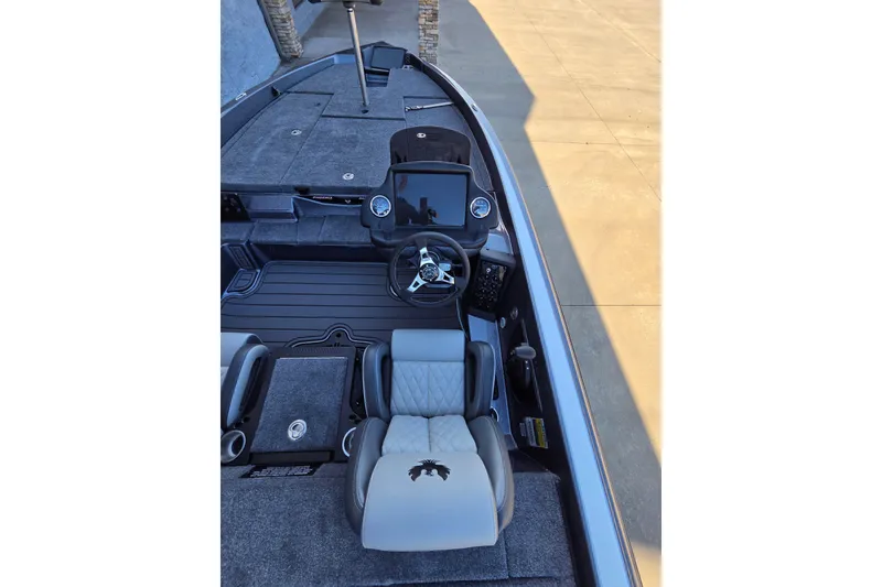 Slide: The Image of 2026 Phoenix 818 Pro boat interior with steering console and seating, showcasing modern design. - 7