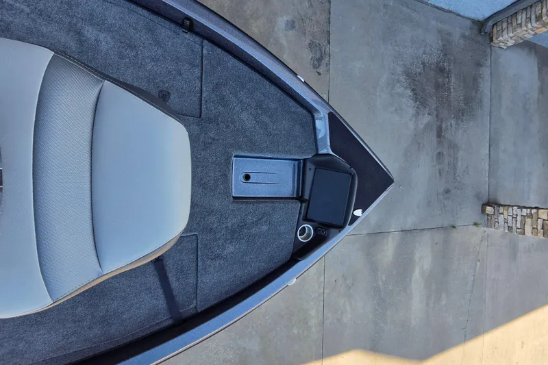 Slide: The Image of 2026 Phoenix 818 Pro boat interior with gray seating and control panel. - 9