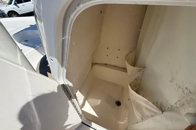 Slide: The Image of Open storage compartment on a 2015 Key West 210 Bay Reef boat. - 15
