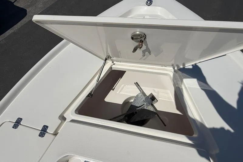 Slide: The Image of Open anchor compartment on 2015 Key West 210 Bay Reef boat, showing anchor storage. - 19