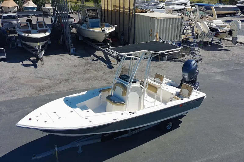 Slide: The Image of 2015 Key West 210 Bay Reef boat on trailer in marina storage area. - 7