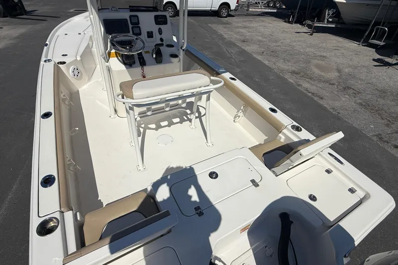 Slide: The Image of 2015 Key West 210 Bay Reef boat interior with seating and console. - 8